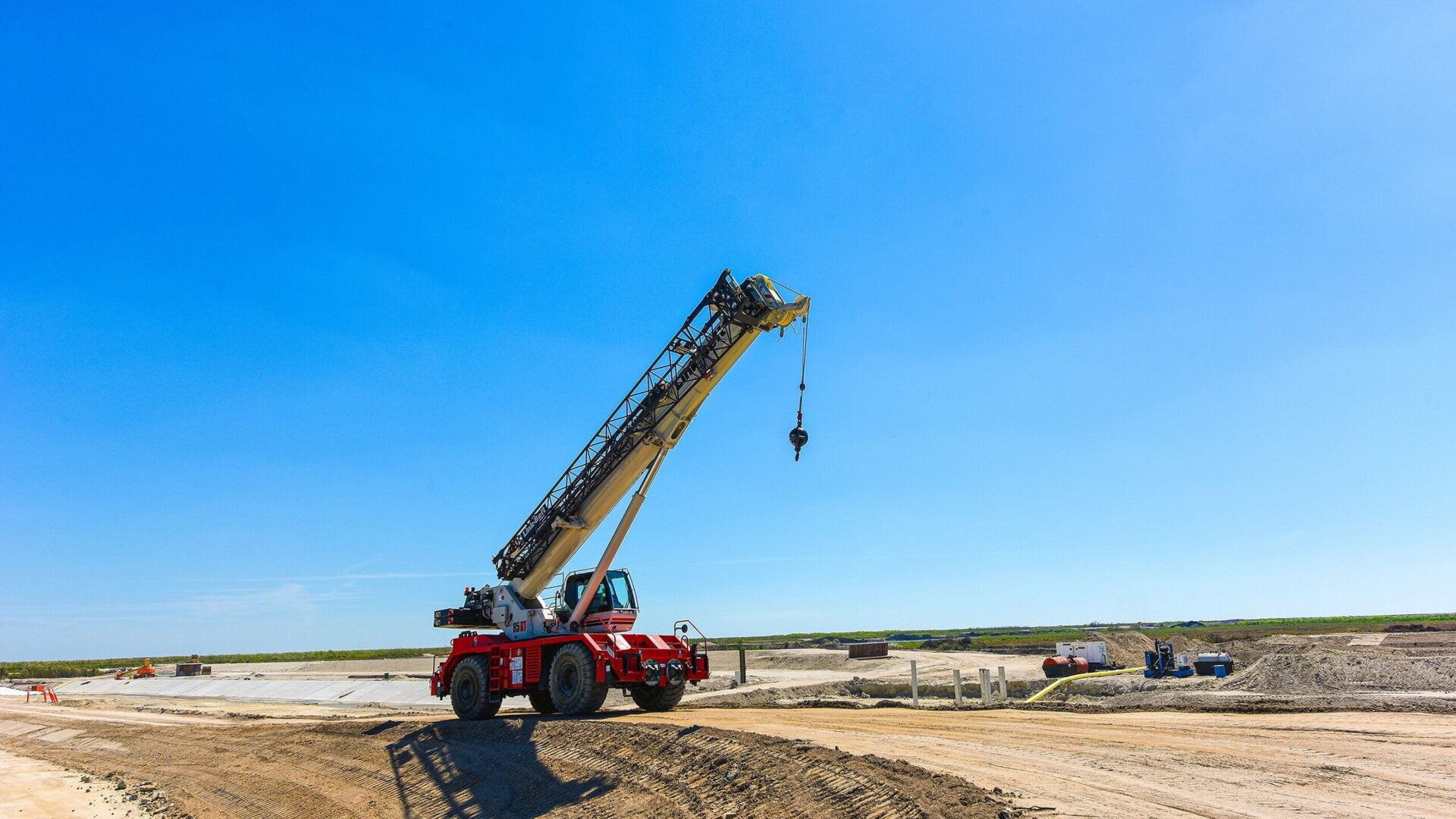 Rough terrain crane lifting on a jobsite