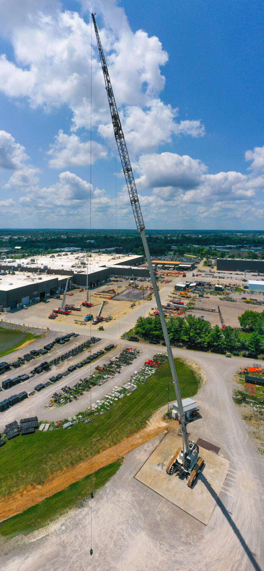 Link-Belt TCC-1800 telescopic crawler crane boom extended at height above an industrial site