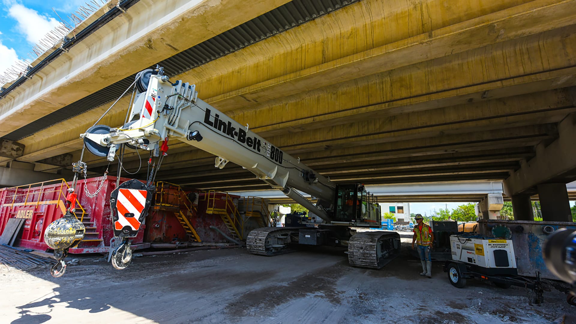Link-Belt TCC-800 telescopic crawler crane working beneath an overpass